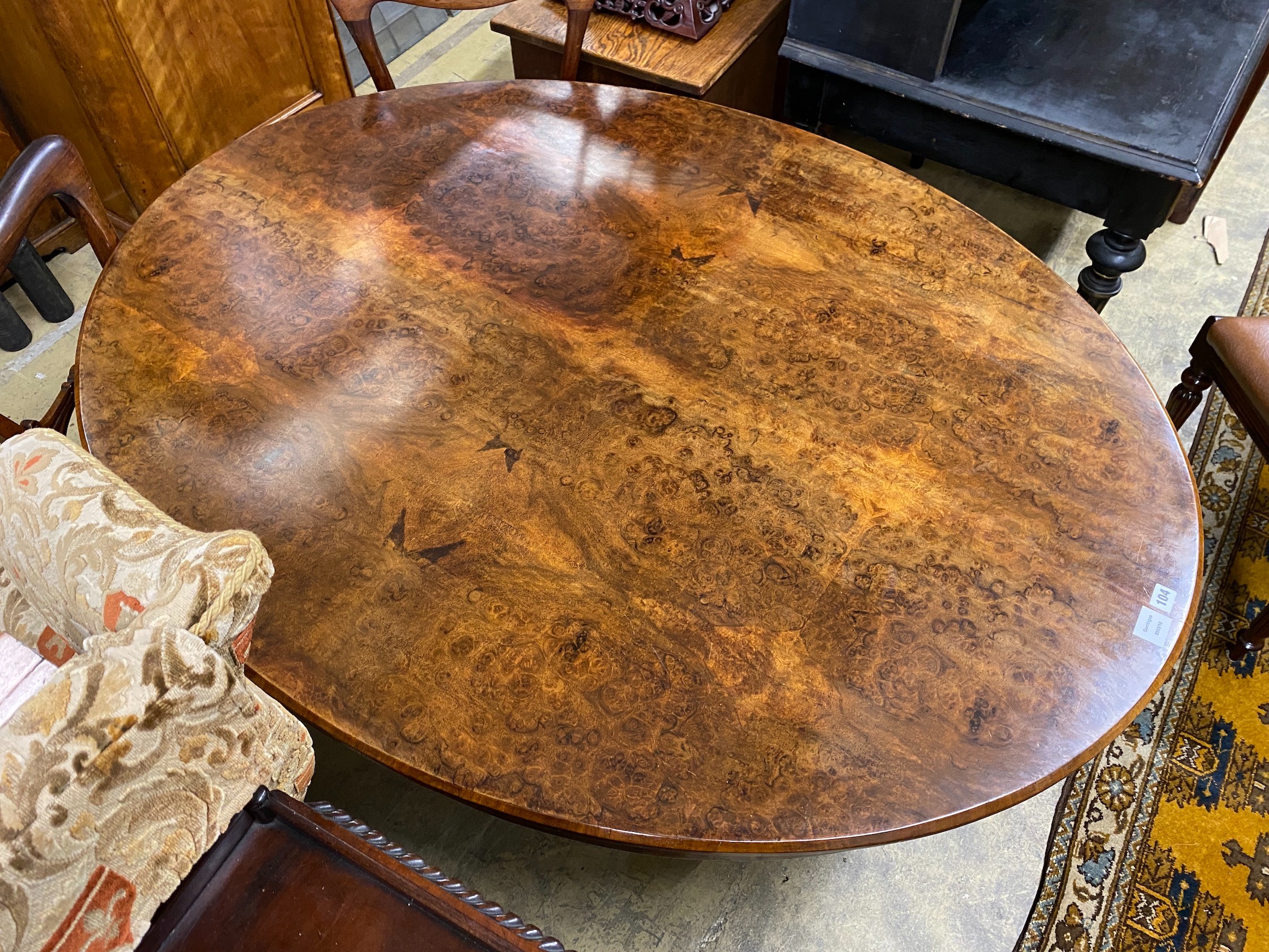 A Victorian oval figured walnut tilt top loo table, length 152cm, width 118cm, height 69cm